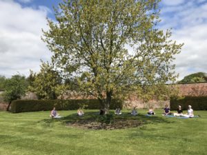 kundalini yoga in the meditation garden at Patrick Brompton Hall retreats